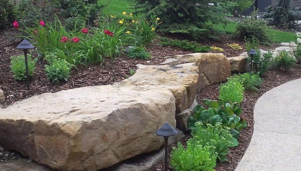 Natural boulder wall Calgary clay soil.